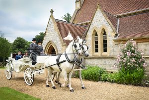 Bride and Groom leaving church in Horse and Cart Royal Chapel Windsor Great Park