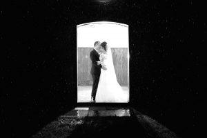 Bride and Groom night time shot in the rain at Ufton Court, reading