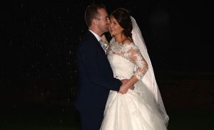 Bride and Groom night time shot in the rain at Ufton Court, reading